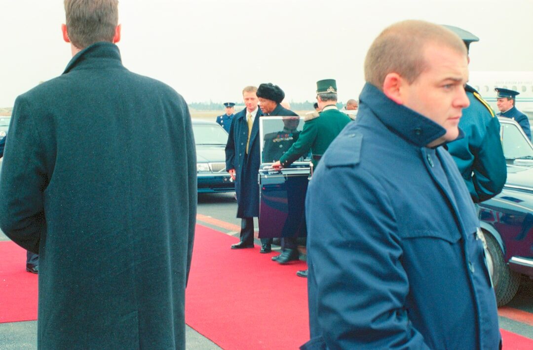 Red carpet event with photographers and flashing lights